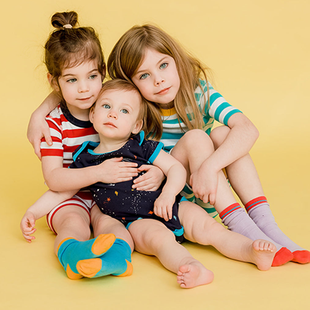 High-quality baby bodysuits in vibrant colors, ideal for comfortable and stylish everyday wear