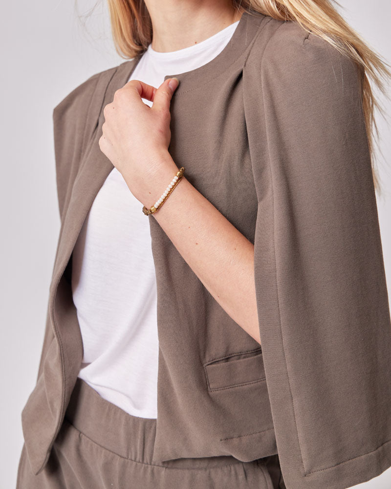 Elegant sage maternity blazer, ideal for nursing mothers seeking the best maternity clothes